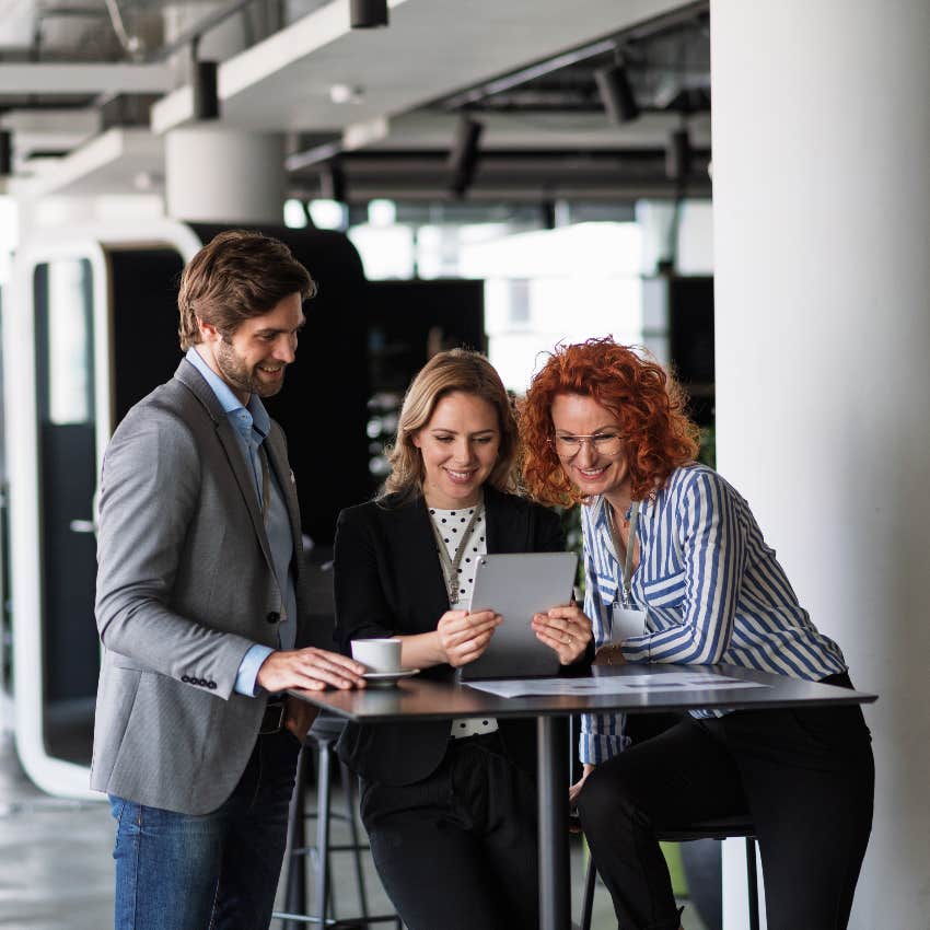 workers receiving AI training from boss