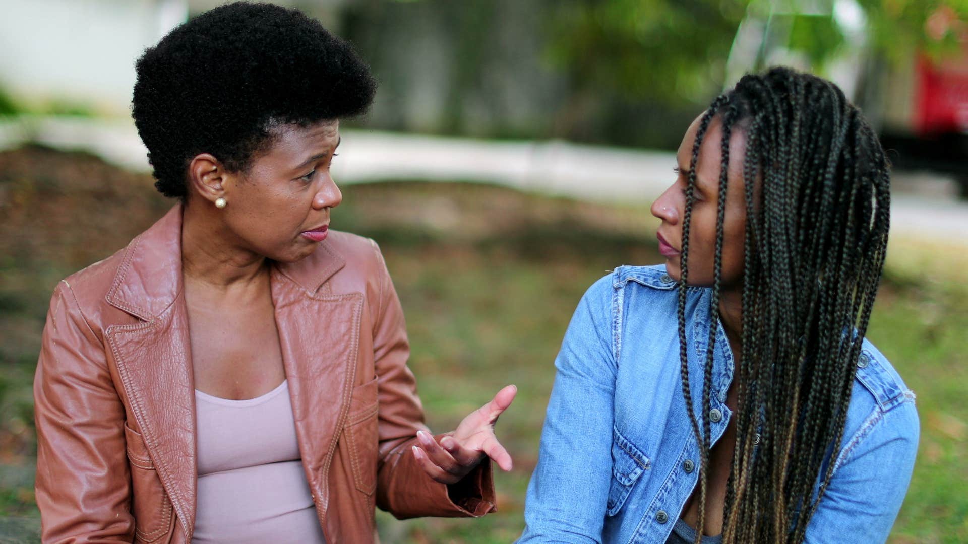 young woman listening to friend speak instead of waiting for her turn to talk
