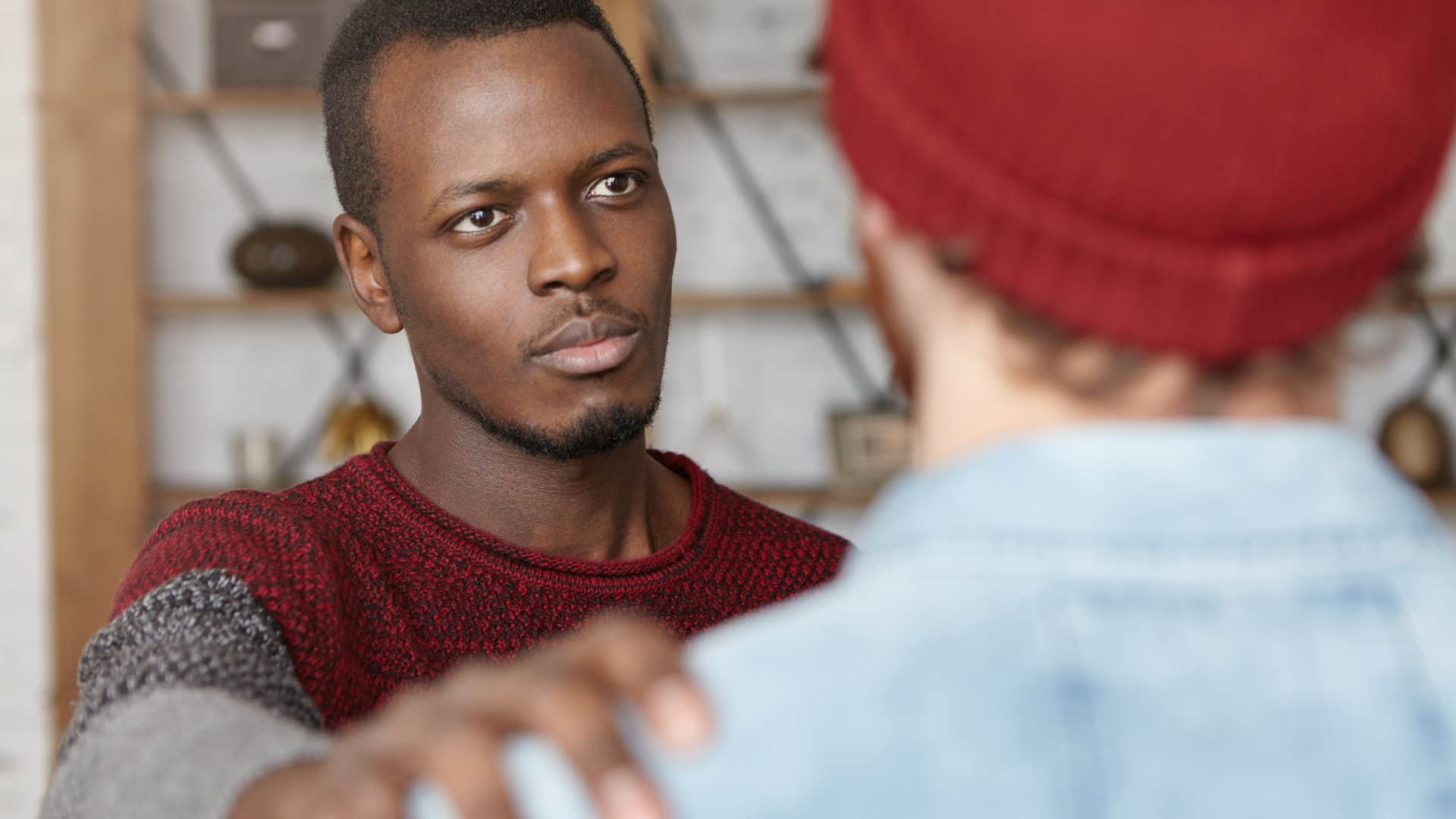 man not oversharing in conversation with friend