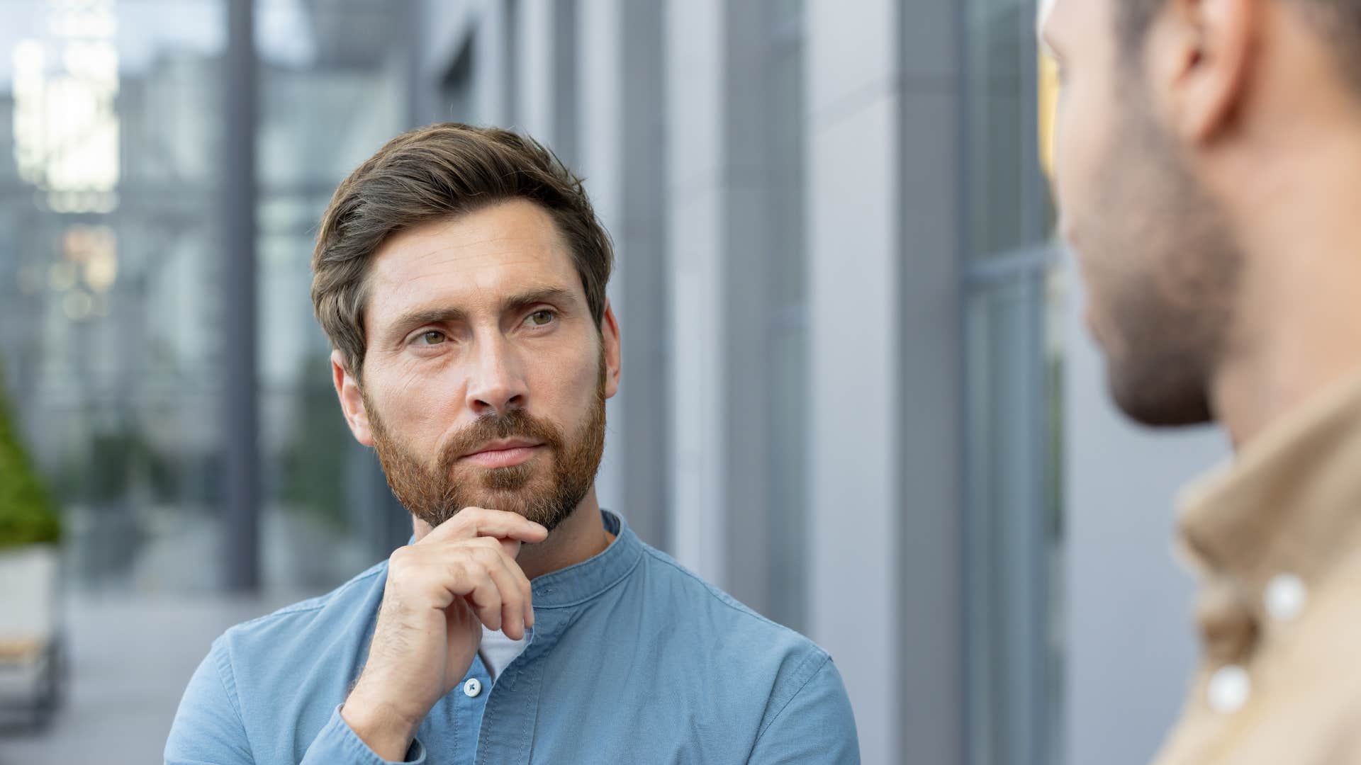 man not using his phone during conversation