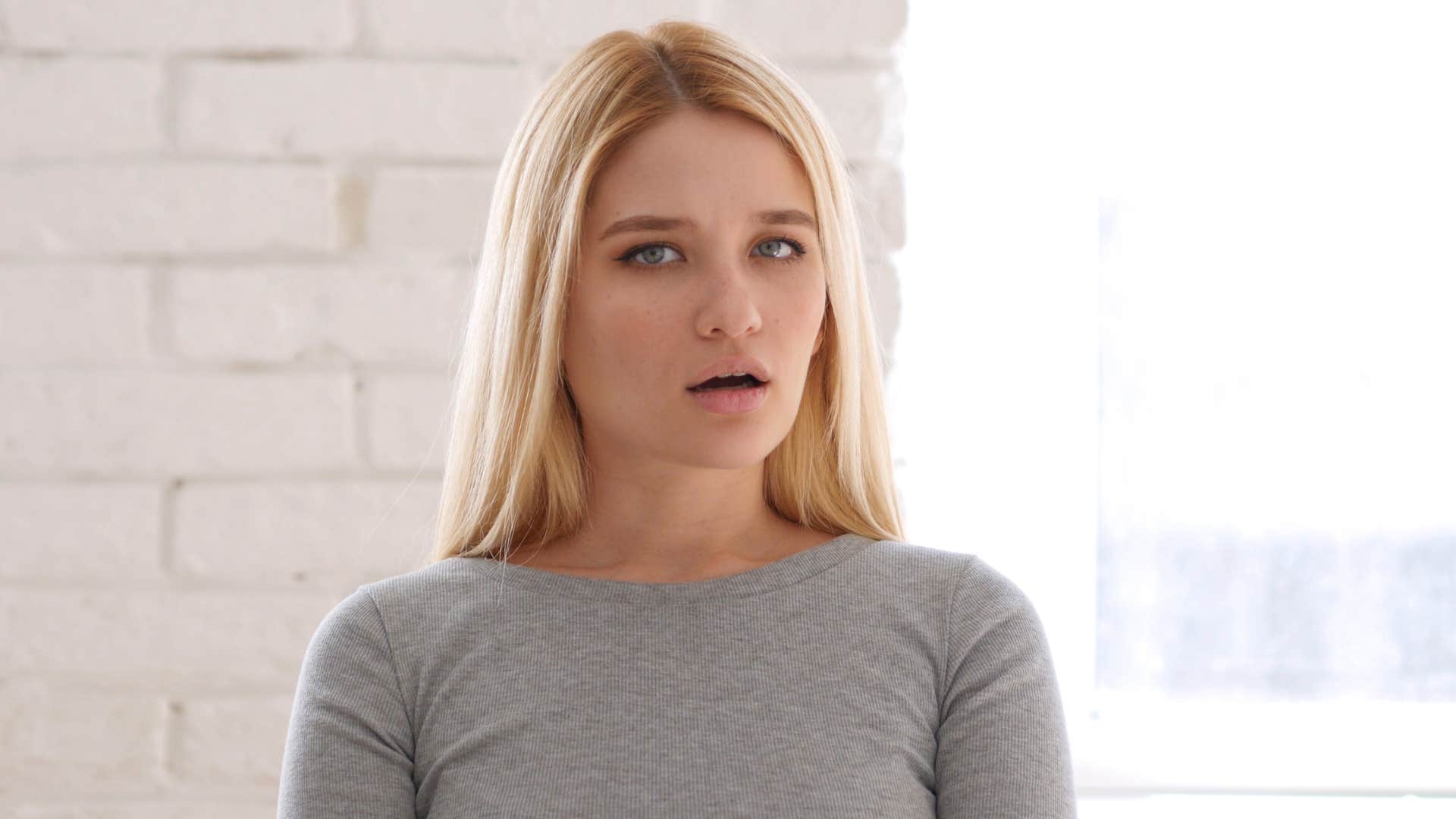 woman who experienced near misses with timing looking surprised