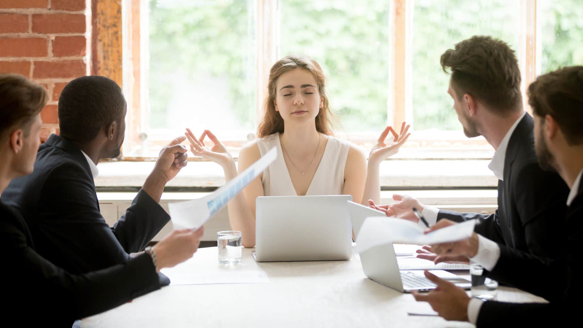 woman feeling calm during chaos at work
