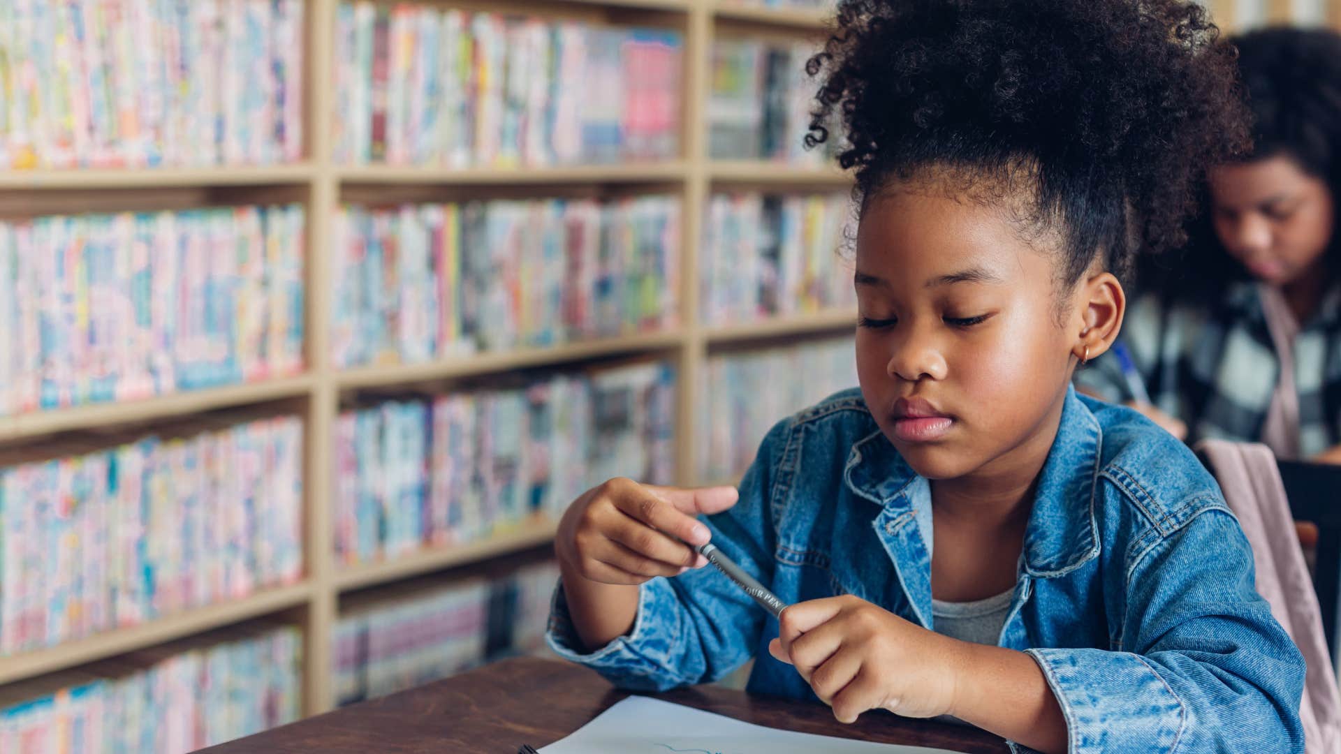 Little girl who doesn't quit when things are hard at school.