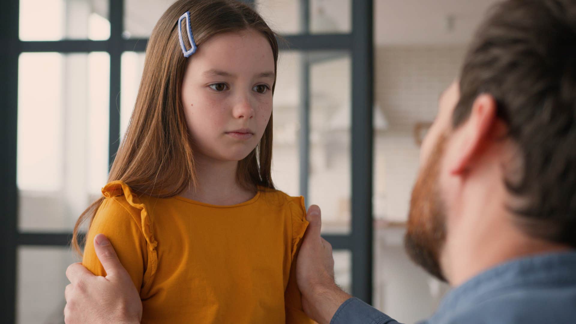 Little girl learning to take accountability at home.