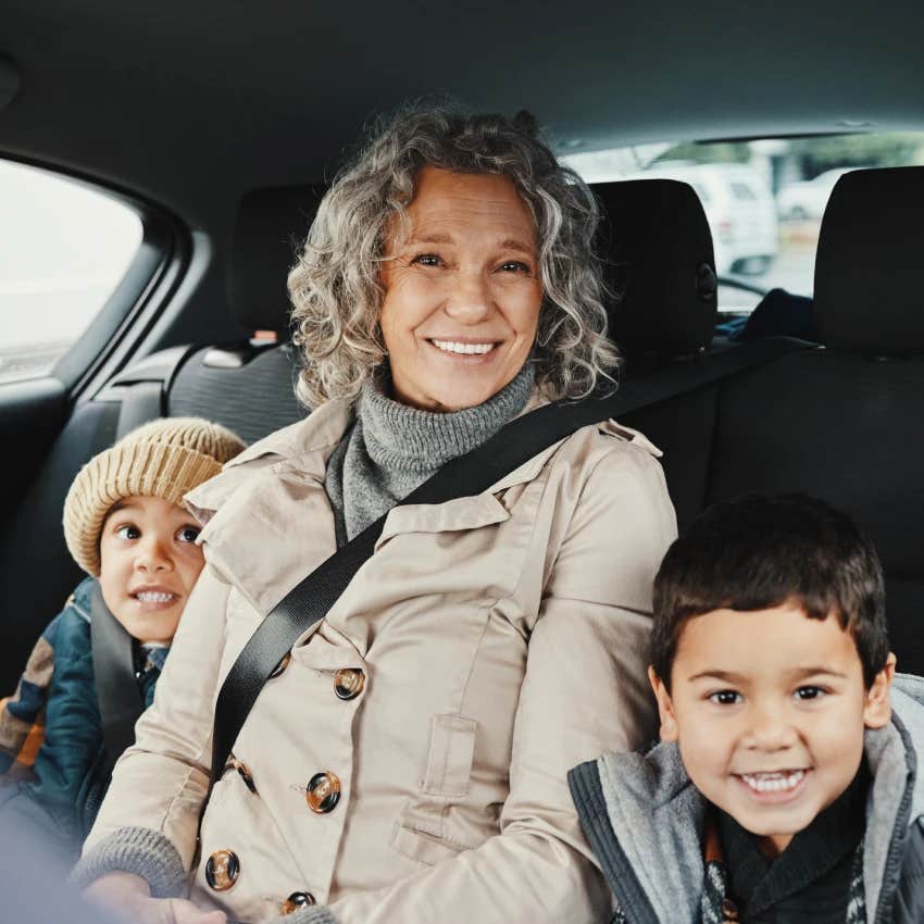 grandma with grandkids in the back of car