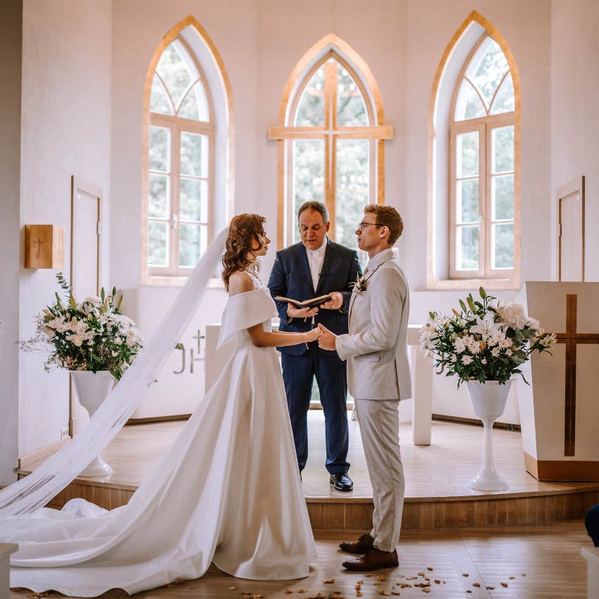 bride and groom having a silent wedding in church
