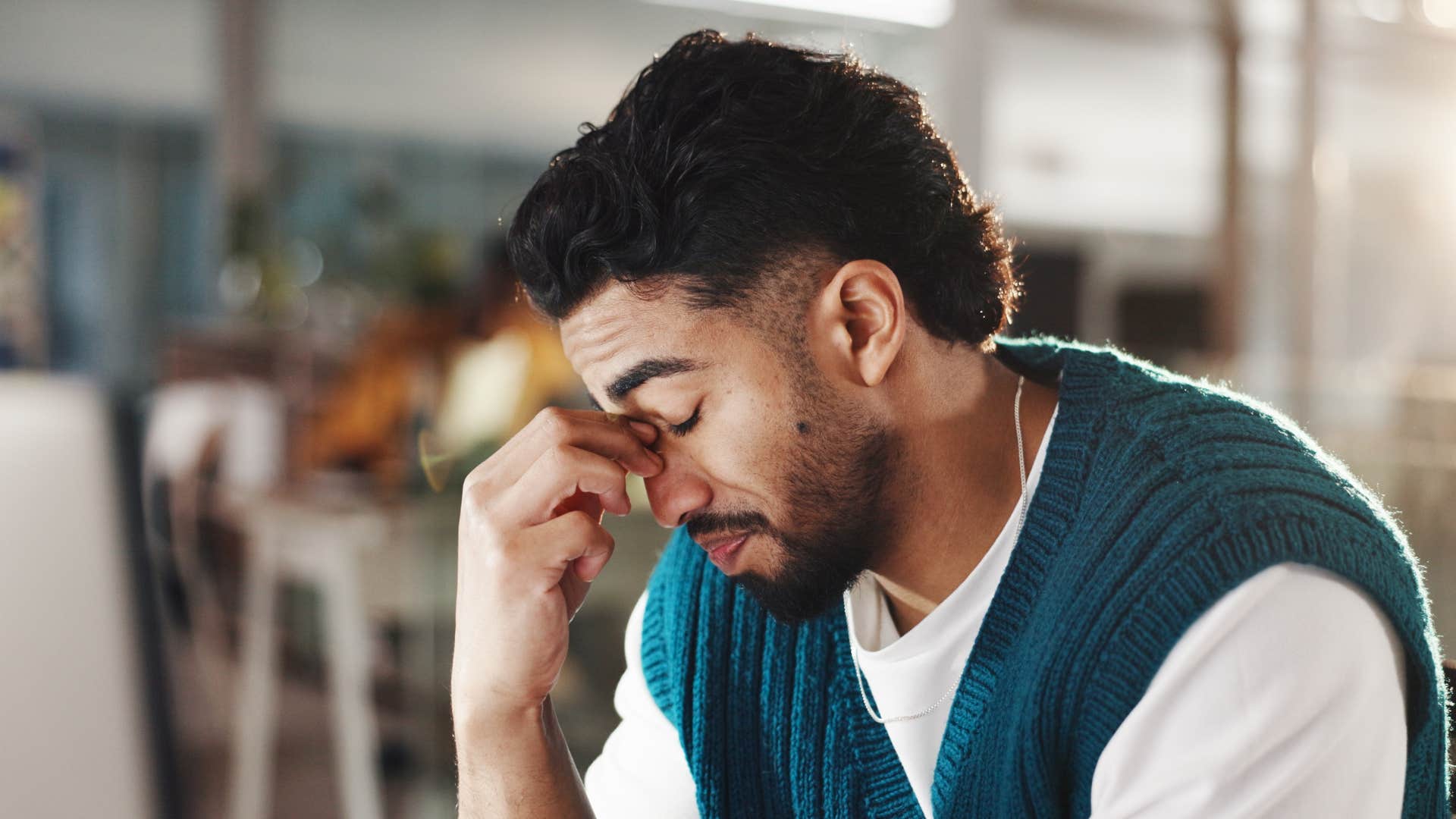 upset man feeling prone to anxiety at work