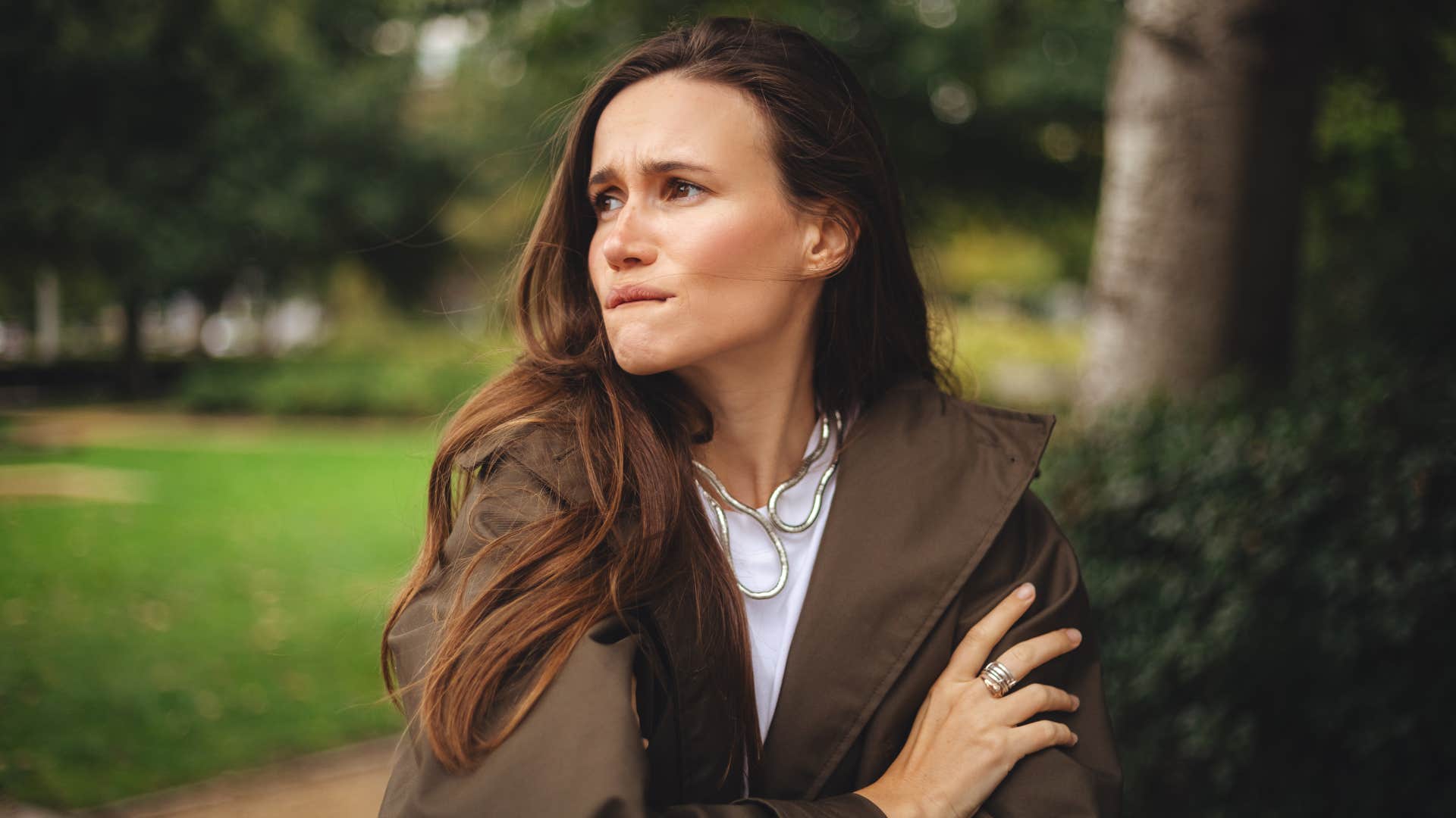 woman who is bothered by bright overhead lights being emotionally sensitive