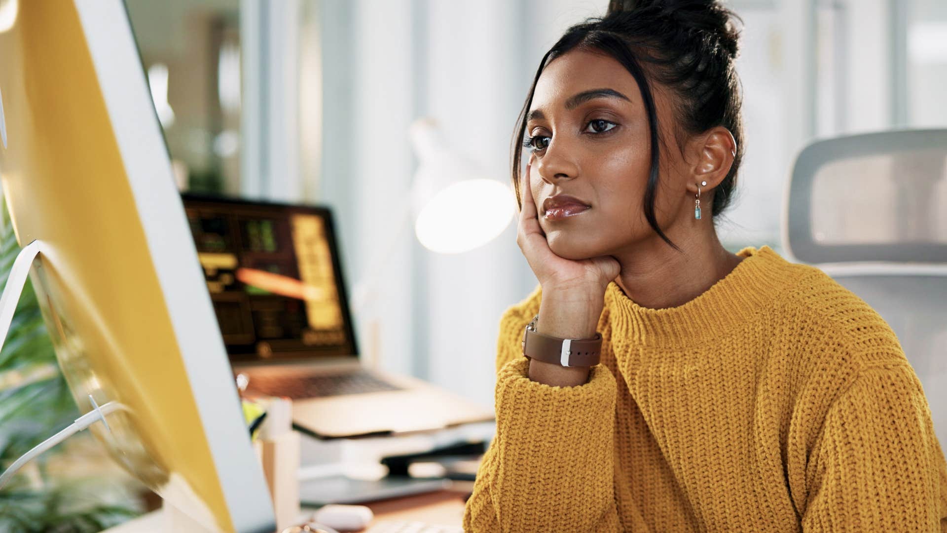Unhappy person at work showing they feel trapped