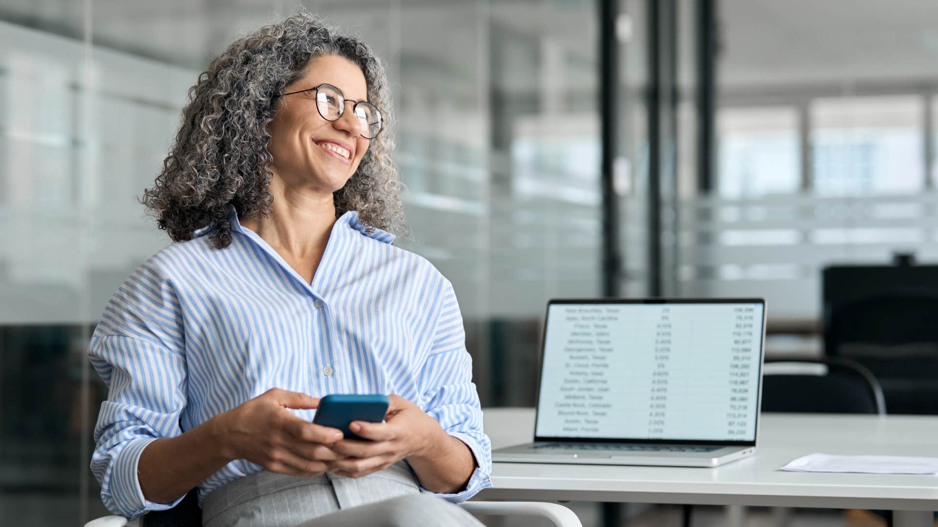 Happy person works with multiple devices showing career is identity