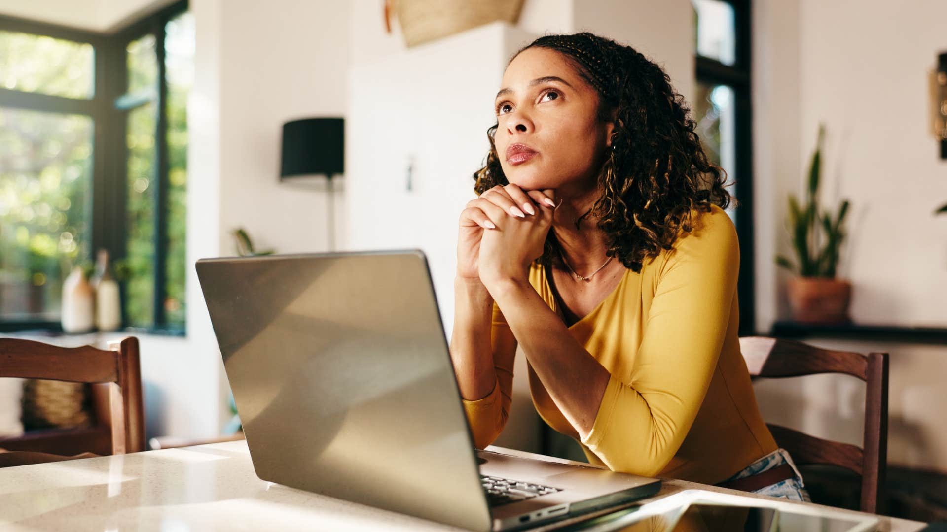 Uncertain person at laptop showing not too late to change jobs
