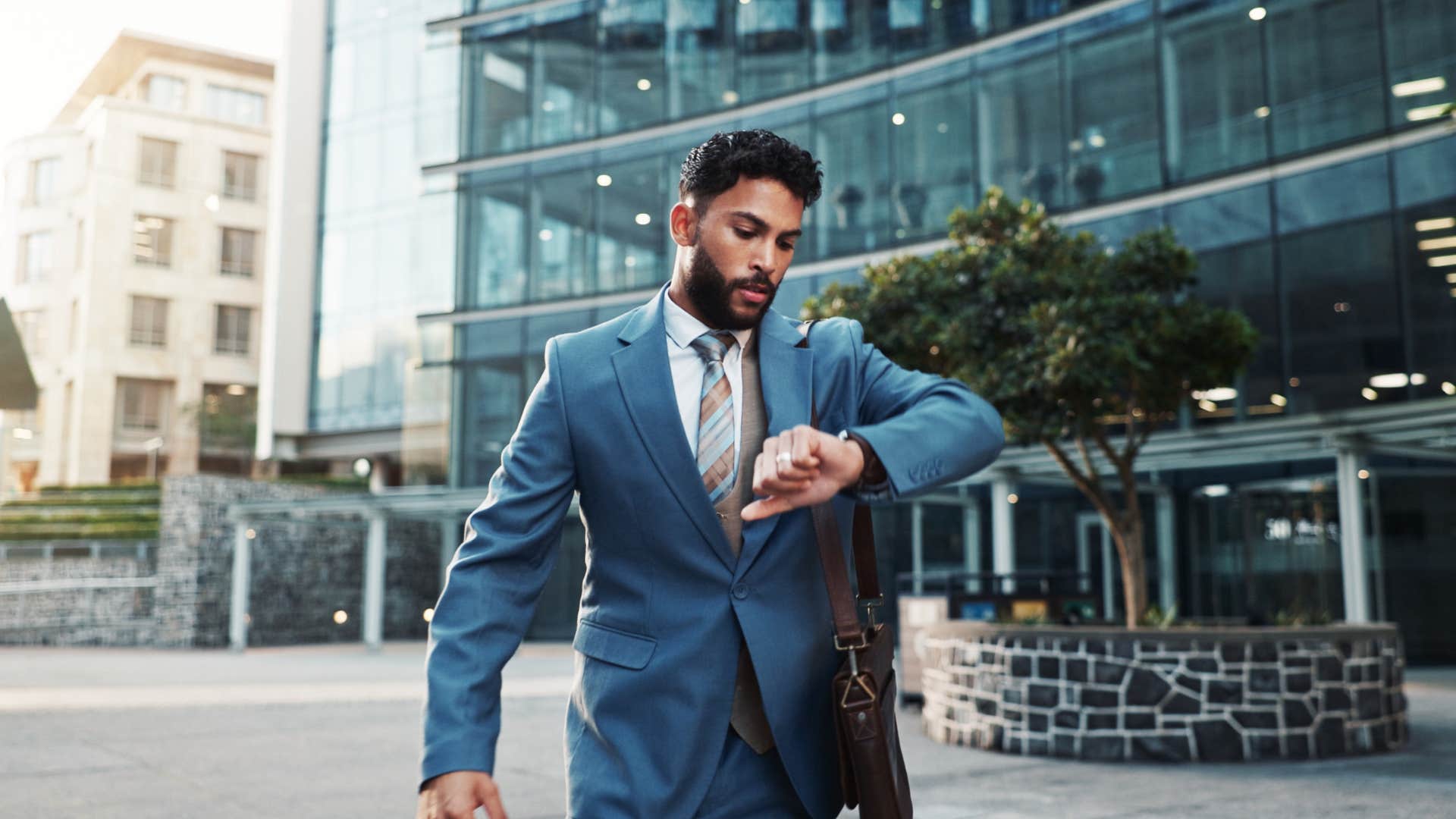 Busy professional check time showing they feel trapped in job