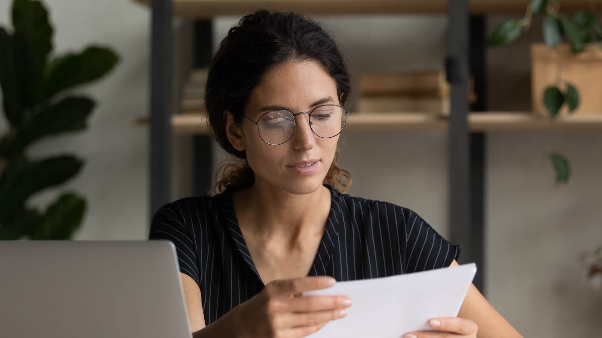 Job applicant double checks cover letter for mistakes