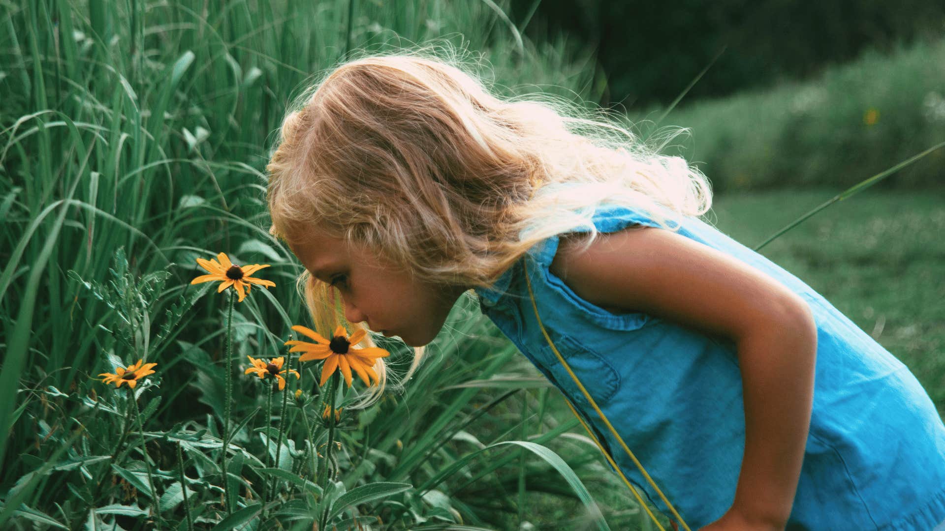 child curiously exploring nature