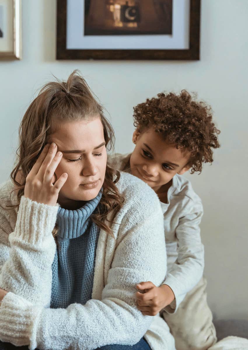 child hugging stressed mom