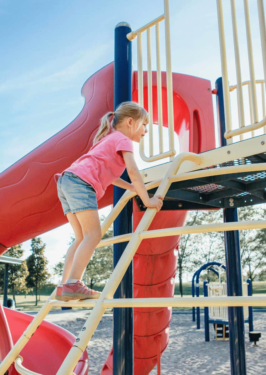 child playing at park playground