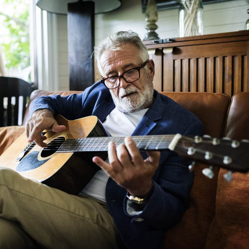 older man playing guitar has lower dementia risk
