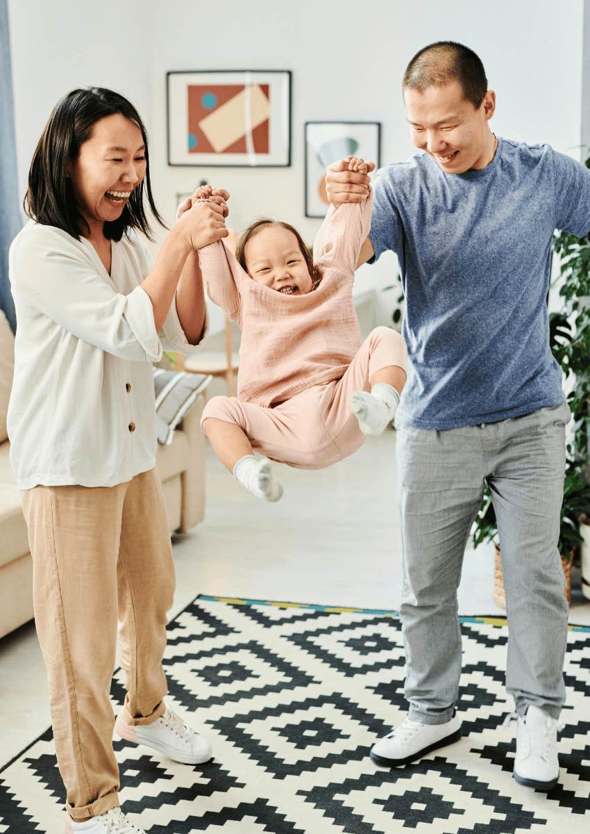 couple being playful with their young child