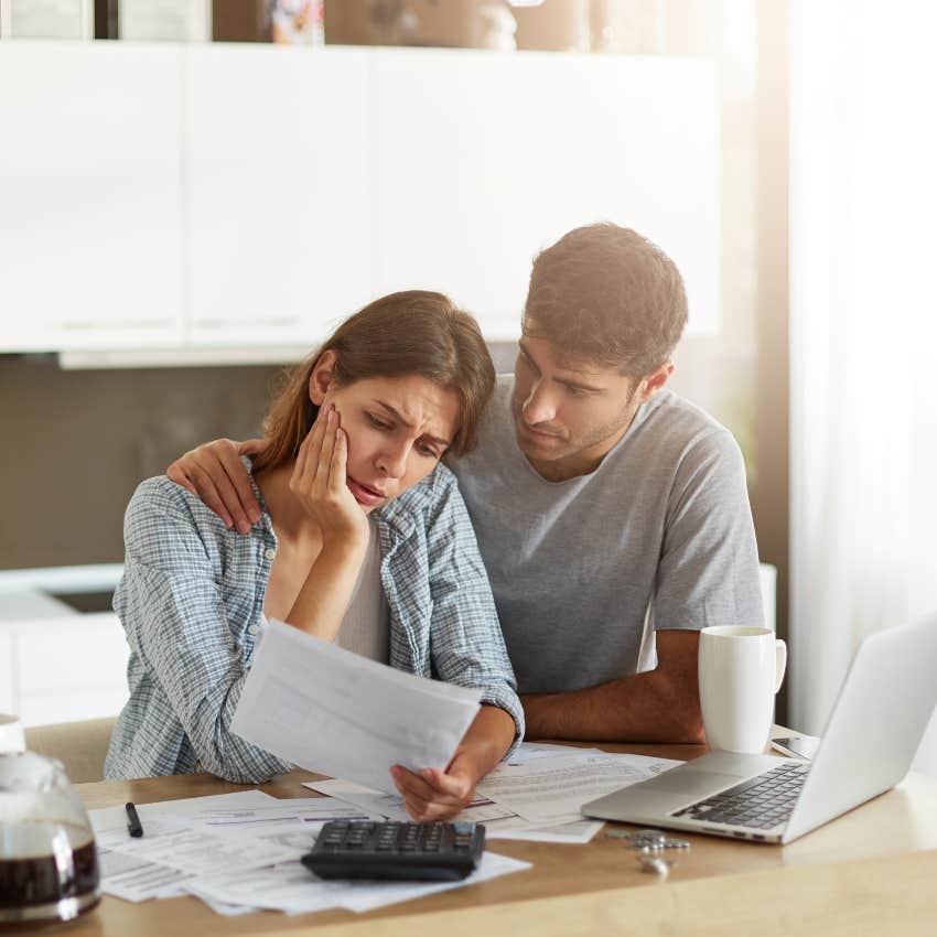 stressed couple paying bills