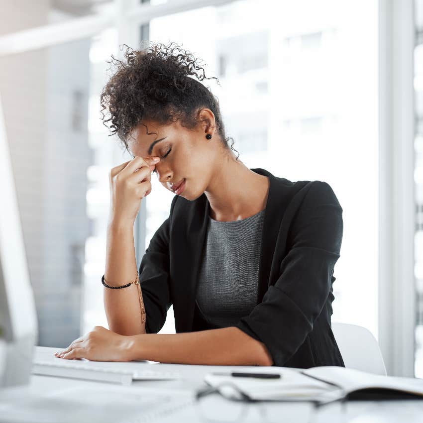 woman stressed at work with bad communication has low morale thanks to corporate jargon