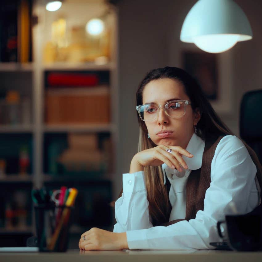 woman who is not motivated and faking it at work