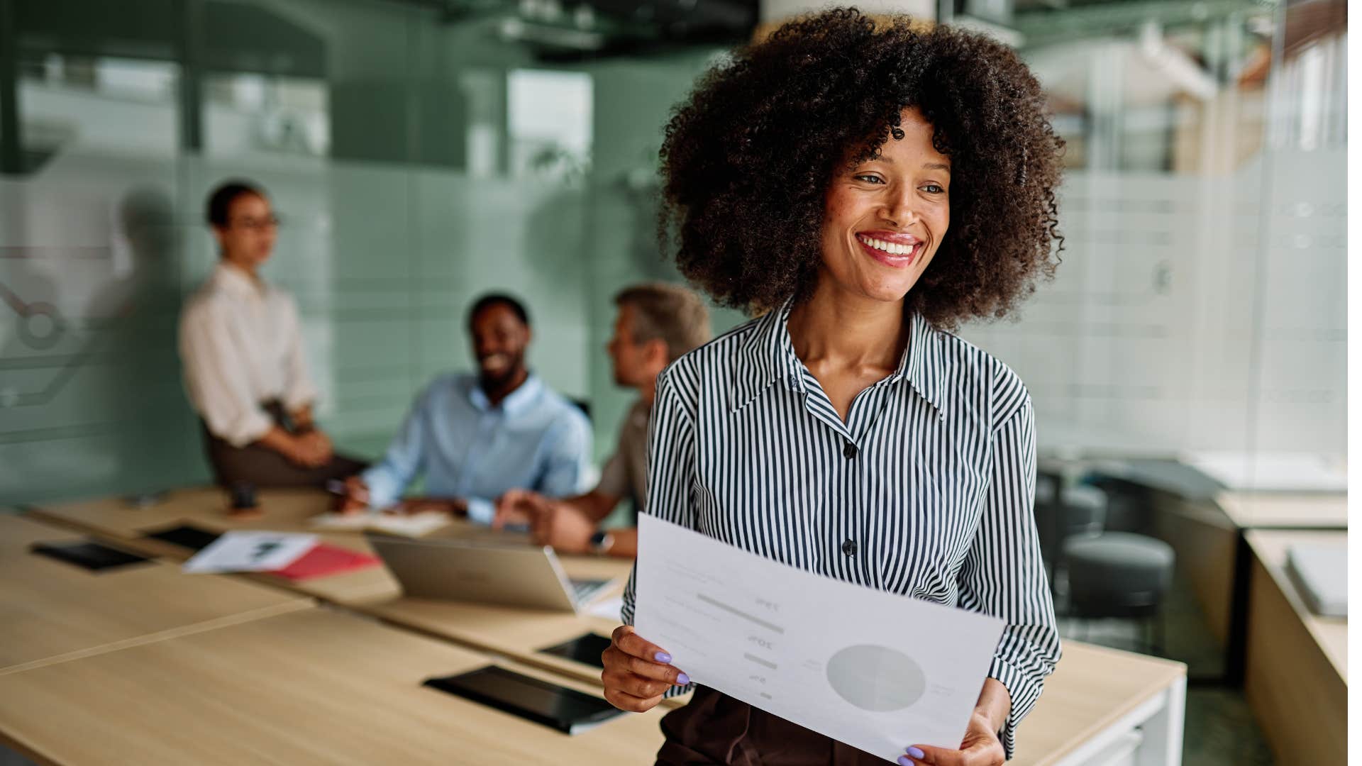 Happy business person with plan showing they abandoned need to win
