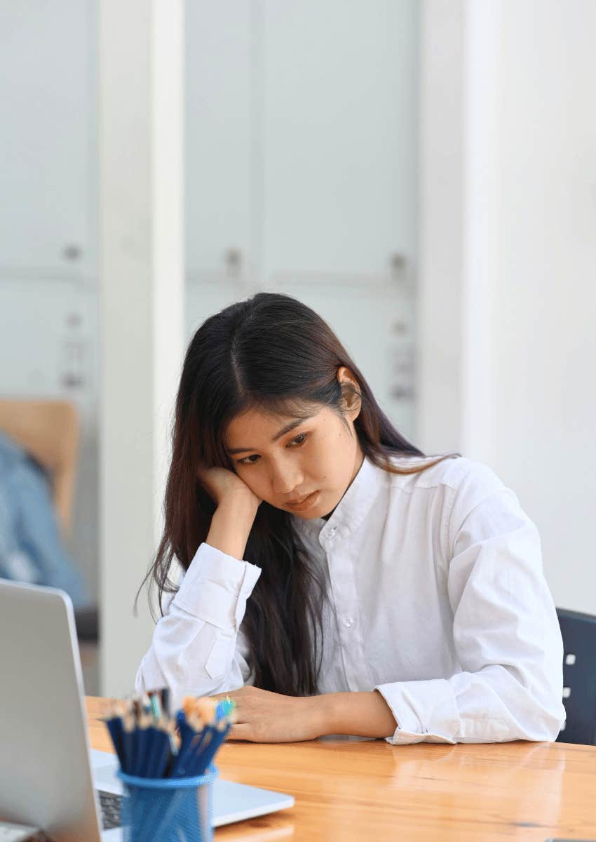 exhausted young corporate woman rethinking privileged life
