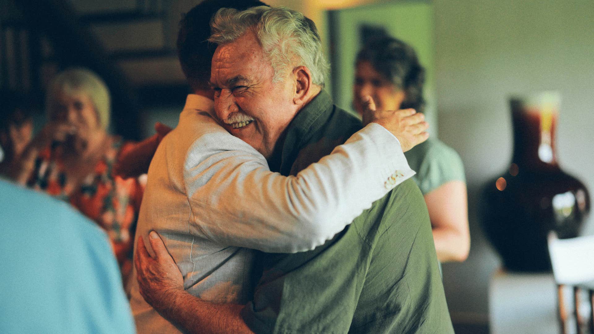 hugging at family reunion regretting not making amends