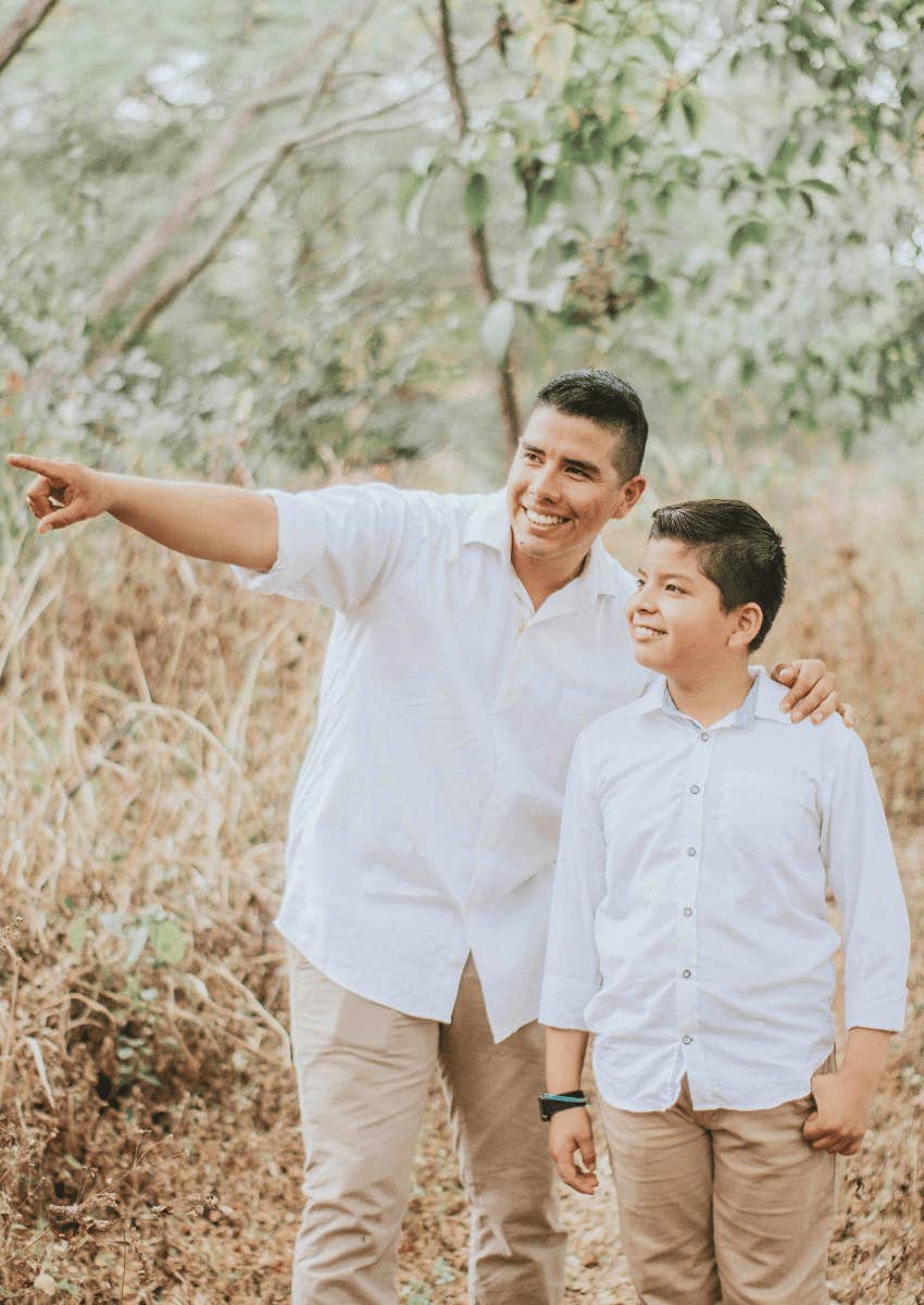 father walking alongside son