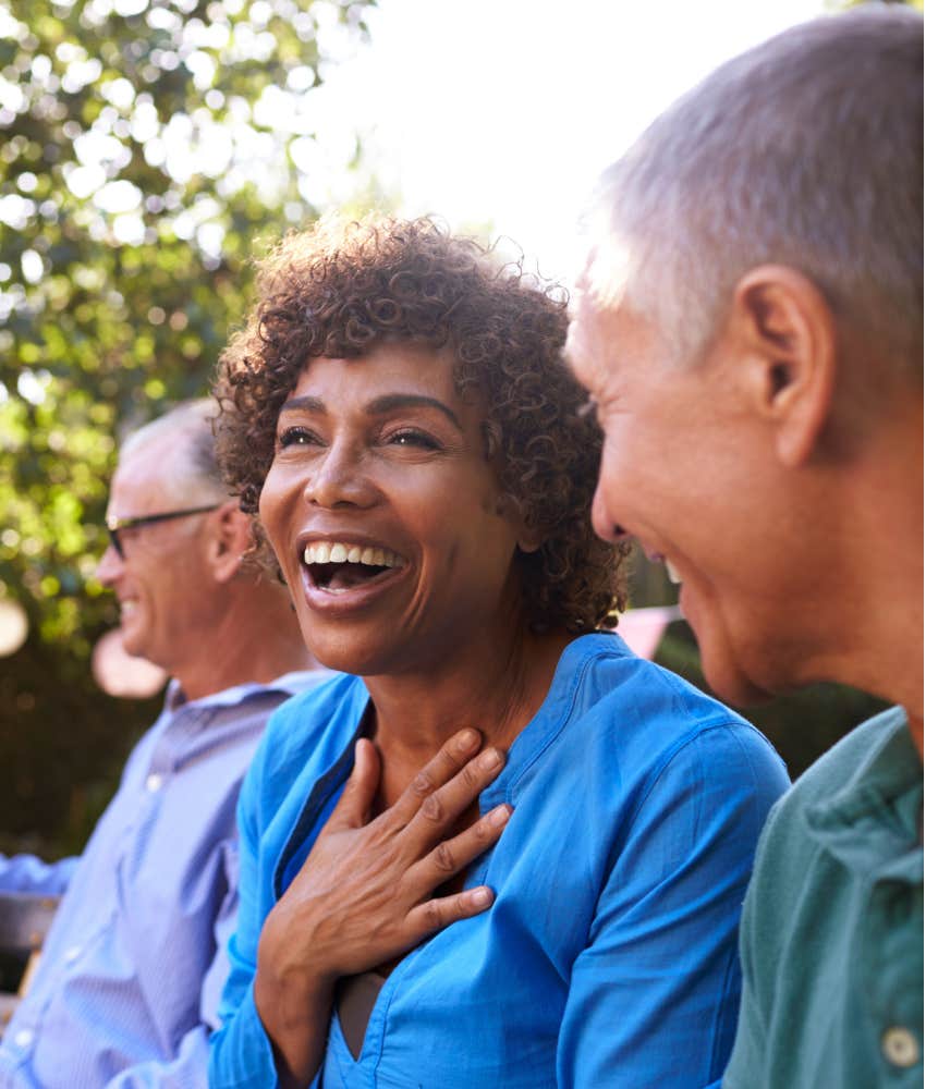 Happy older person chats with others