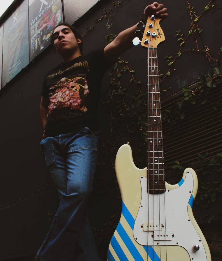 retro image of gen-x rock-n-roller with guitar