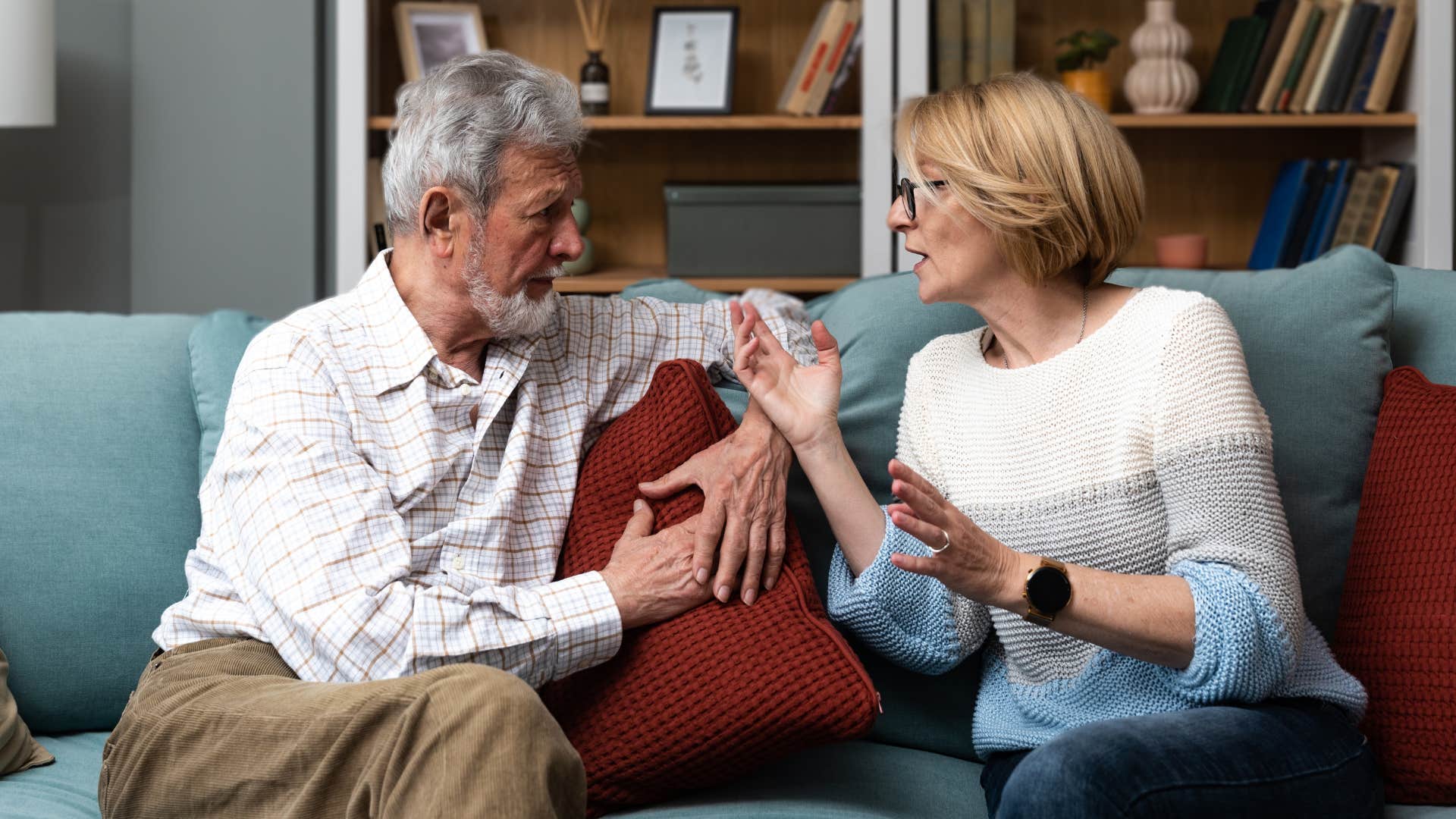 Man who handles conflict directly smiling with his wife.