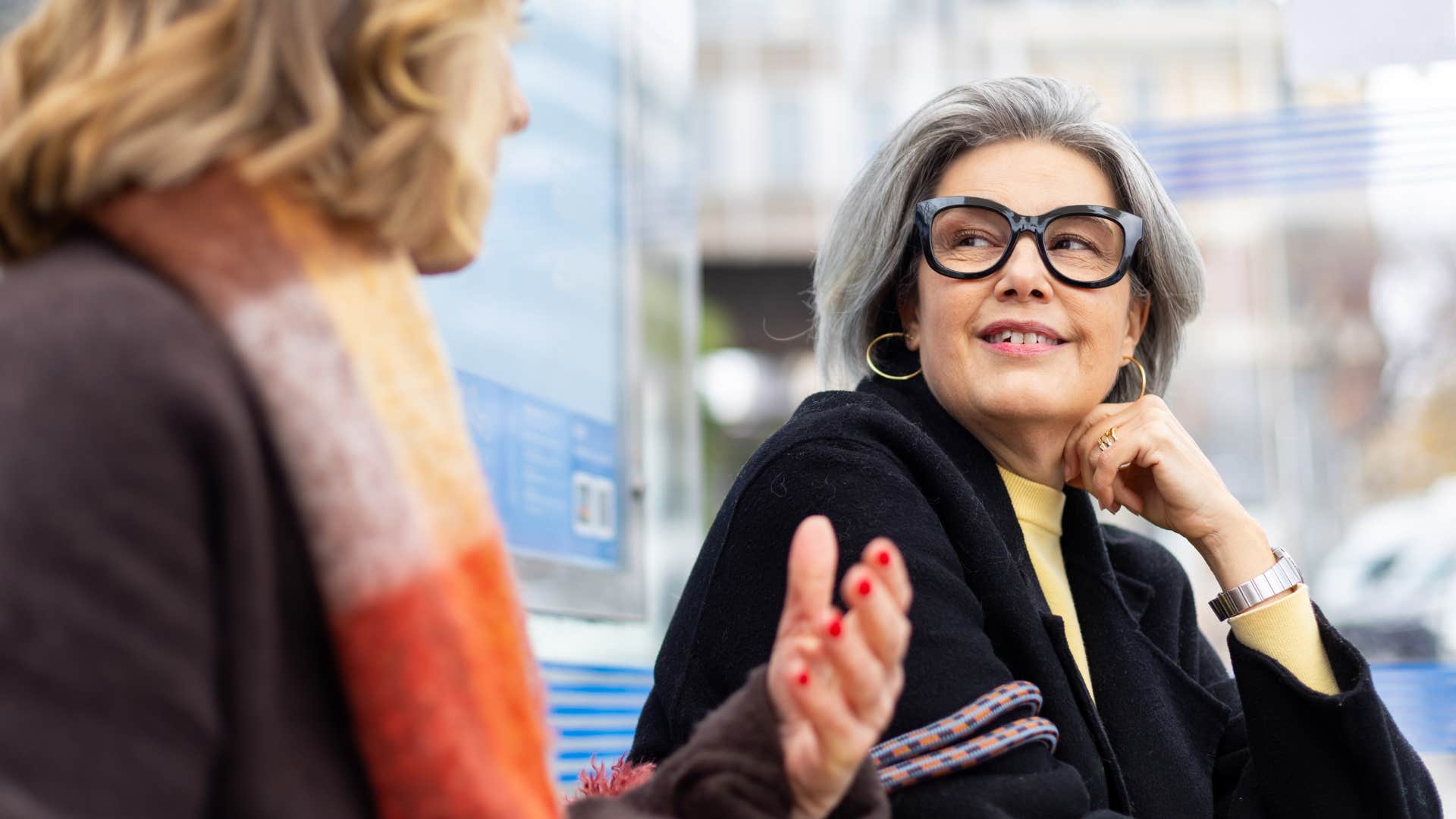 Woman who's loyal to their friends smiling with one.