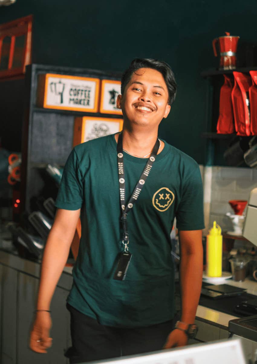 gen-z male employee smiling