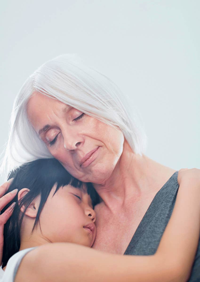 grandmother hugging child close