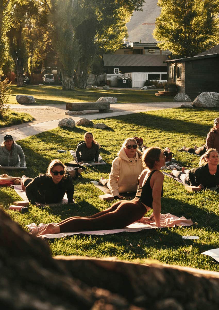 group of women in an outdoor yoga class