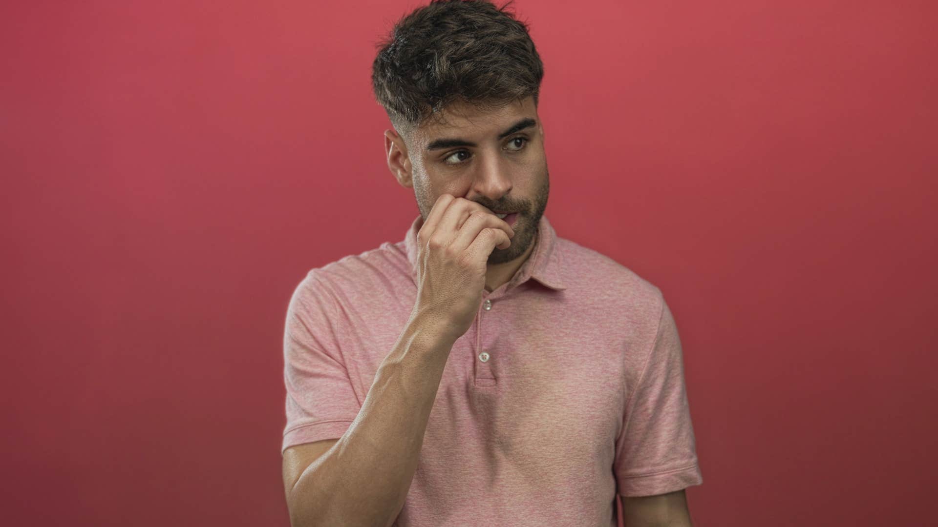 Man whose hard times are coming to an end stands awkwardly 