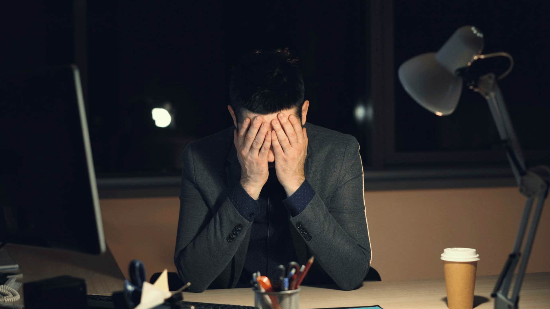 man with head in hands alone feeling hopeless might mean more than sadness