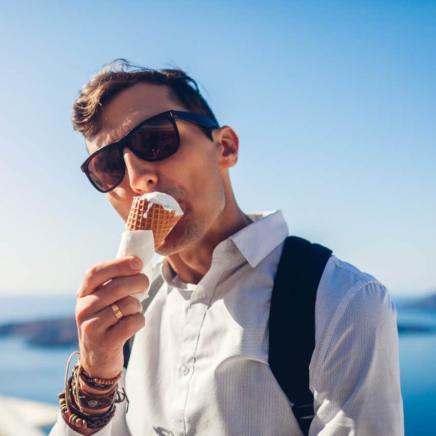 man eating ice cream cone