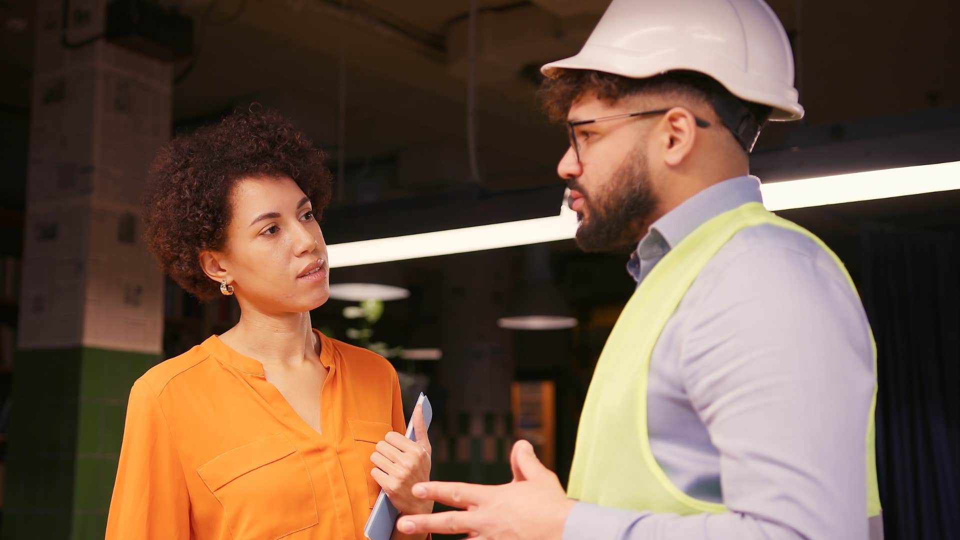 man saying I need help to his boss at work