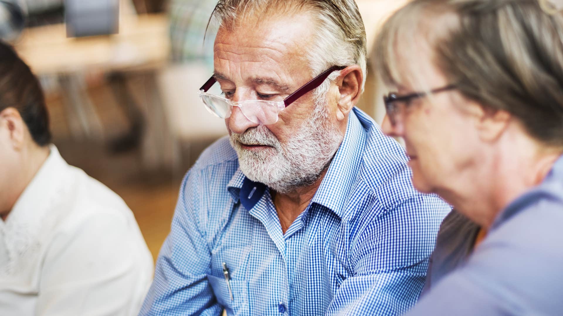 colleagues in a discussion with man saying let's look at it in a different way