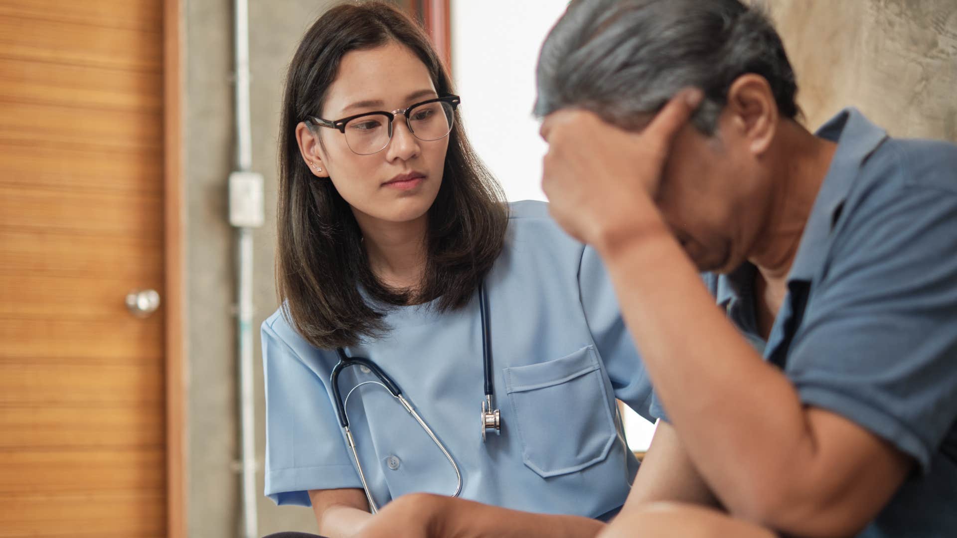 high-iq doctor telling male patient let's take a moment