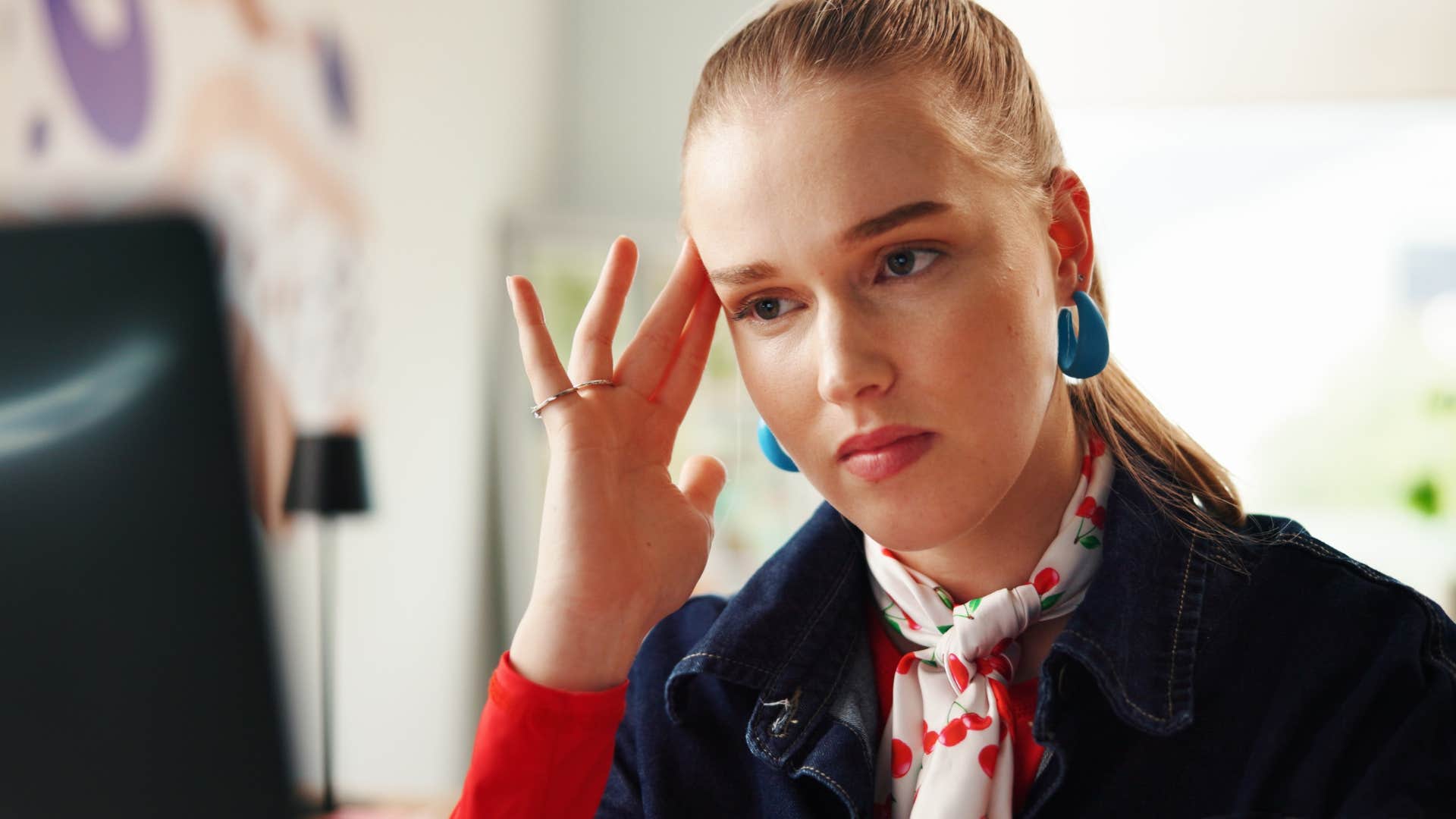 Hyper-independent woman sitting at home thinking.