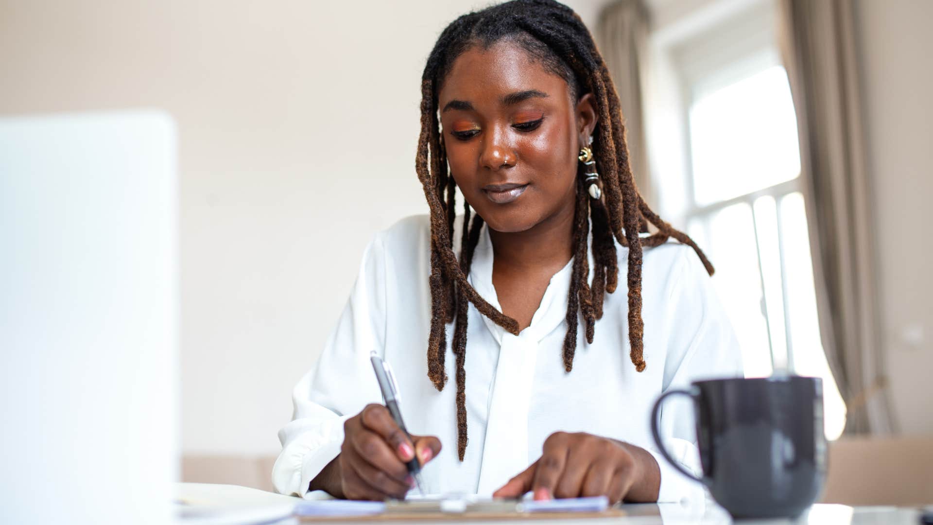 Perfectionist woman working at home.