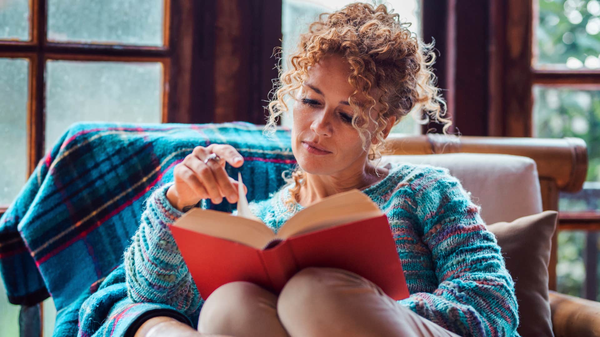 woman who is an old soul saying I'm going to stay in while reading a book