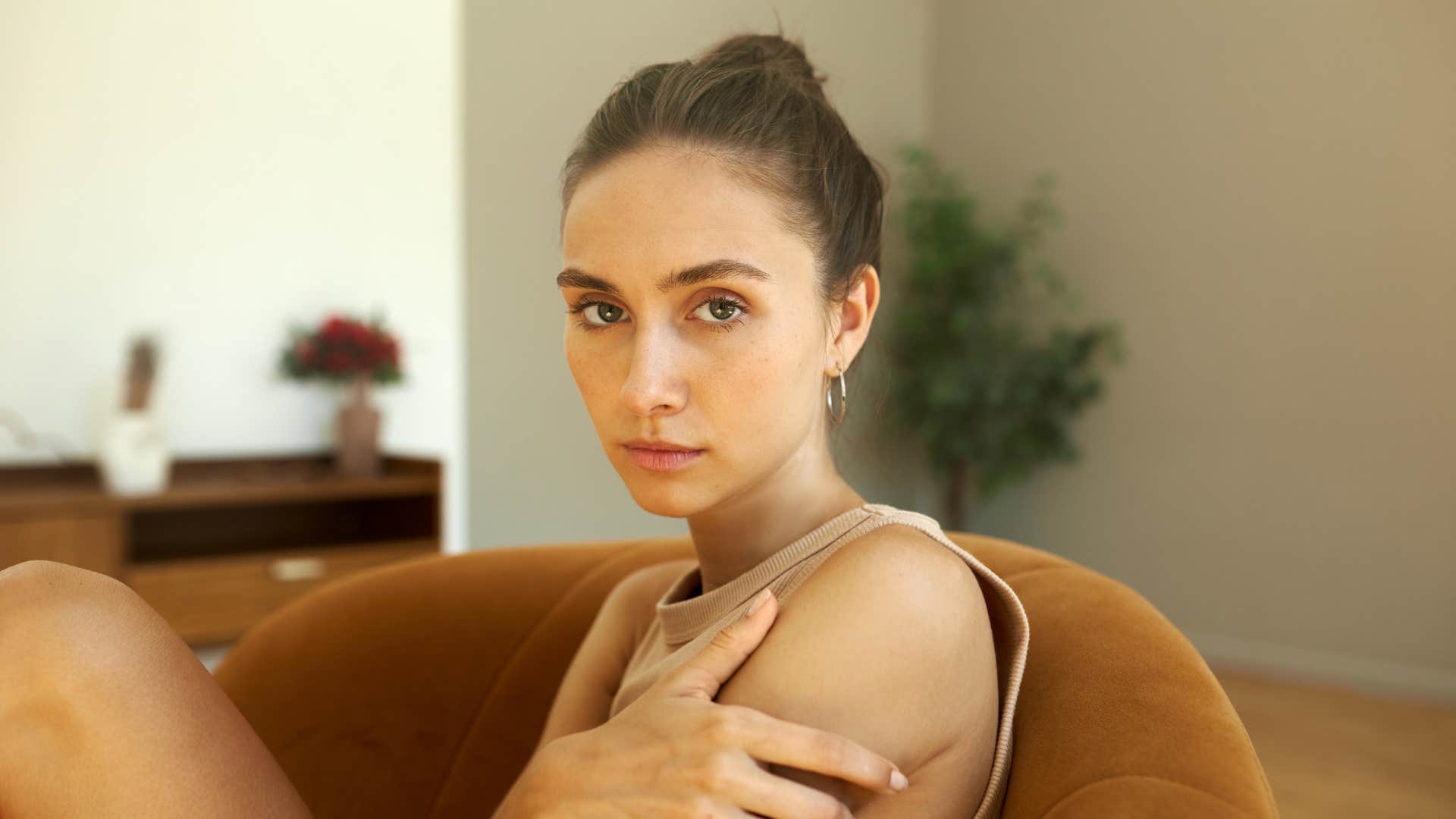 intuitive woman sitting alone at home