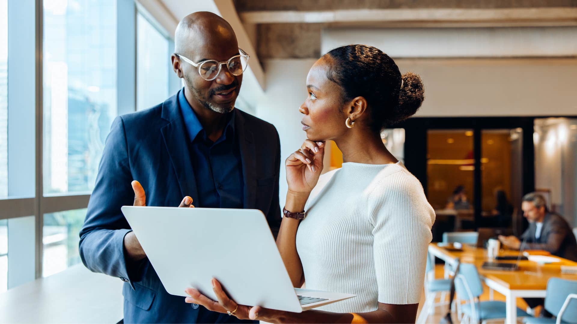 sophisticated colleagues having a conversation man saying i hadn't thought of it that way
