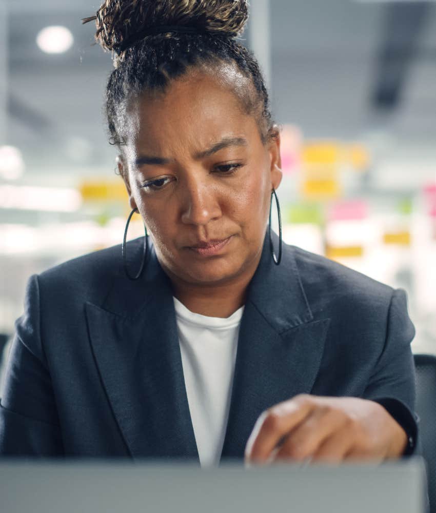 Stressed person at works hold it in showing raised blood pressure
