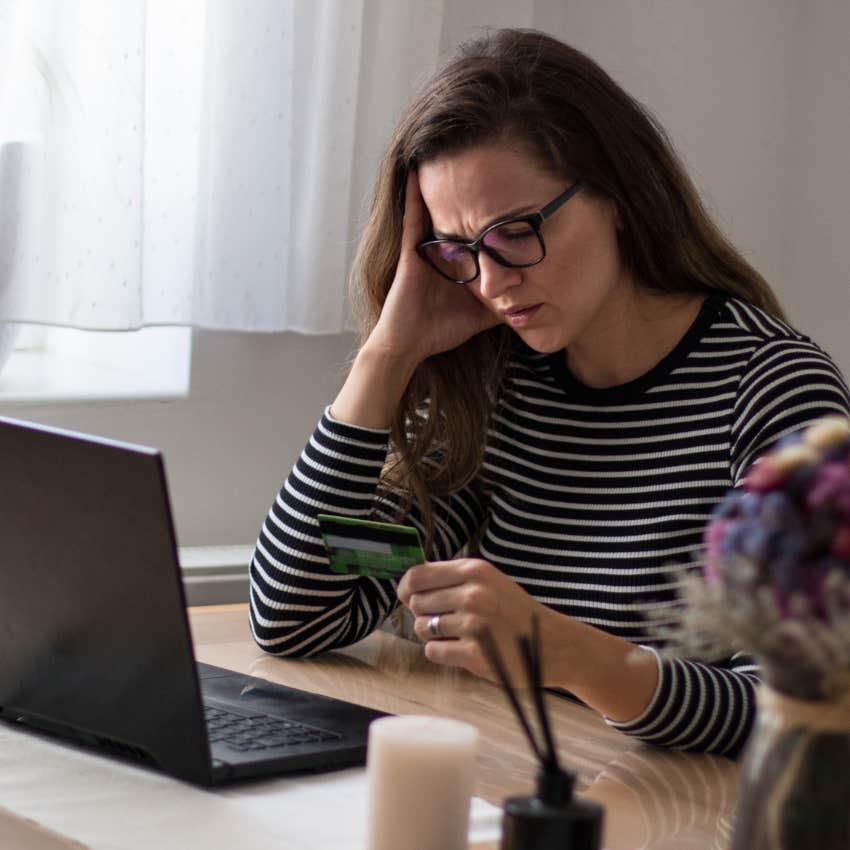 Woman paying for rent and housing at home.