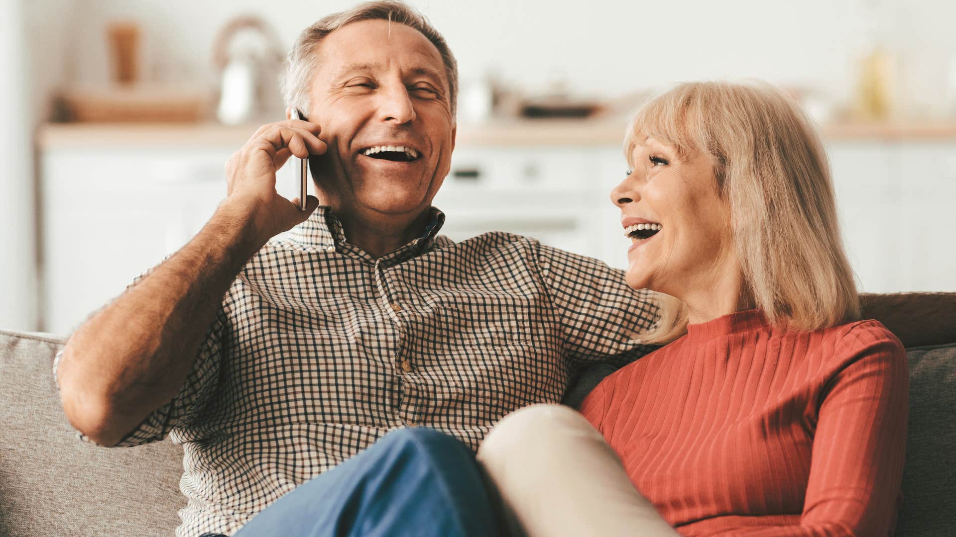 couple who's adapted to cultural changes laughing together